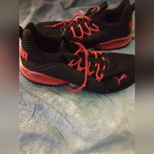 Red and black pumas size 9.5